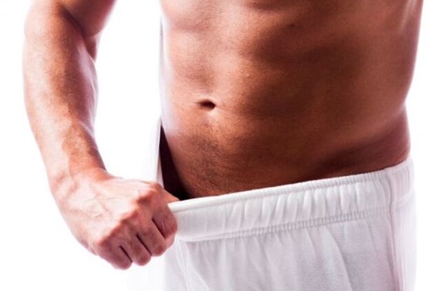 man evaluating penis size